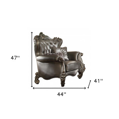 The Velmora – Silver & Platinum Faux Leather Tufted Wingback Chair with Toss Pillows